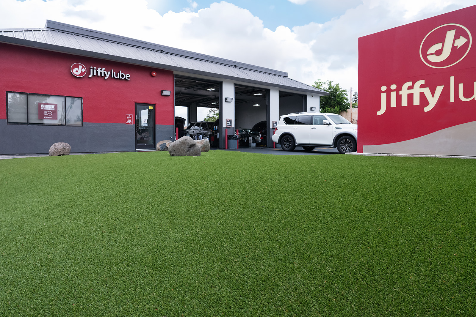 Commercial artificial turf installation at a Sacramento-area Jiffy Lube by Total Turf