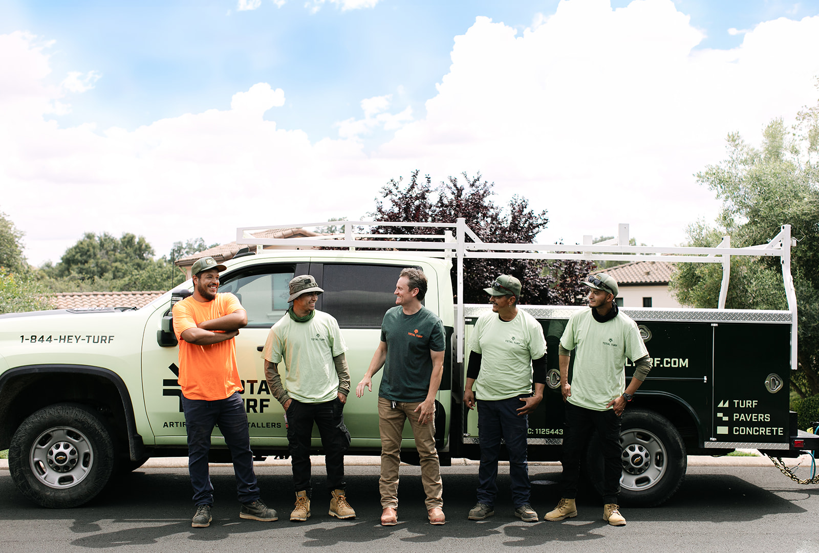 Total turf team. in front of truck 