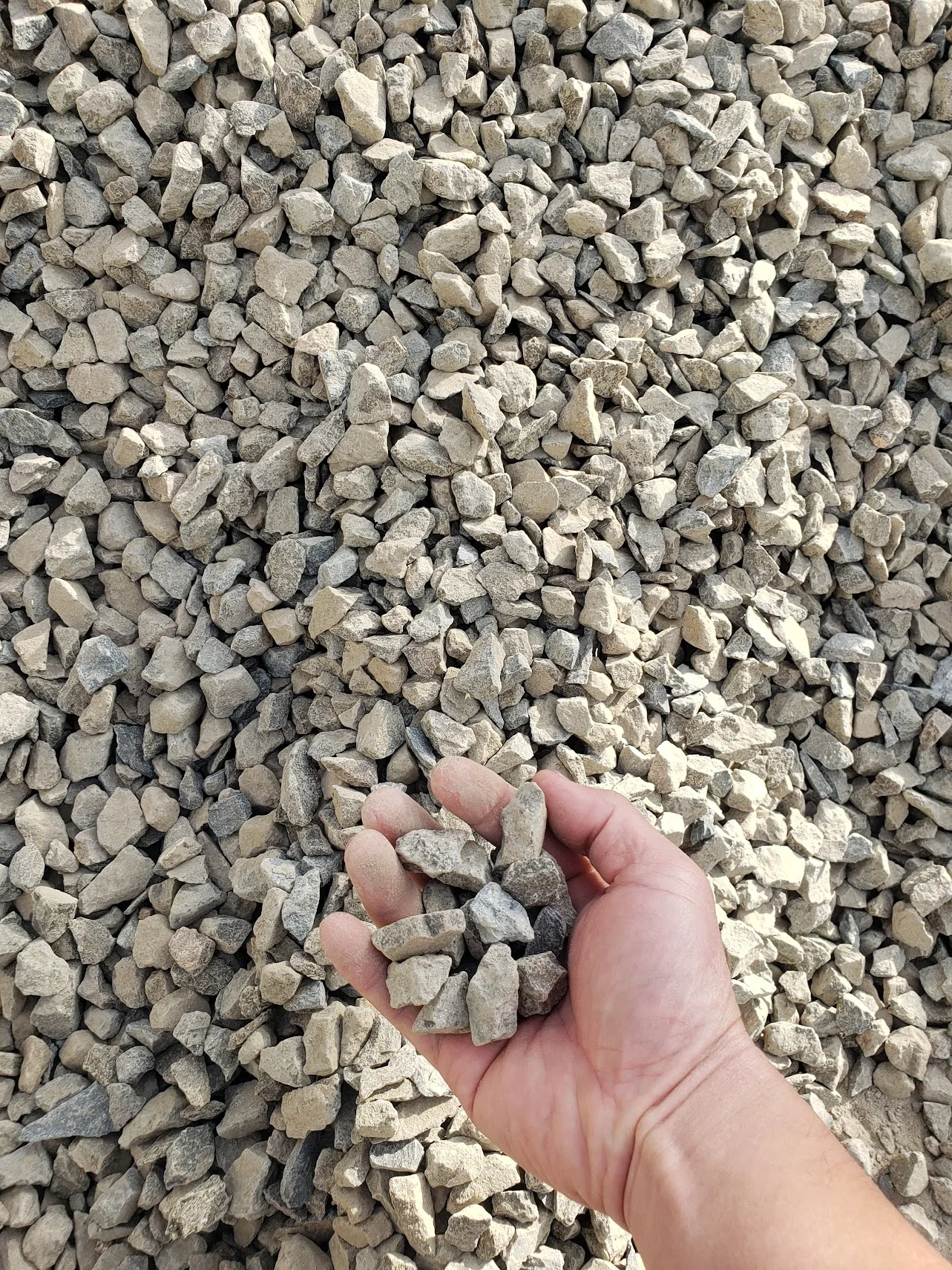 Three-quarter inch Type II base rock, the material spread and plate compacted beneath every Total Turf installation