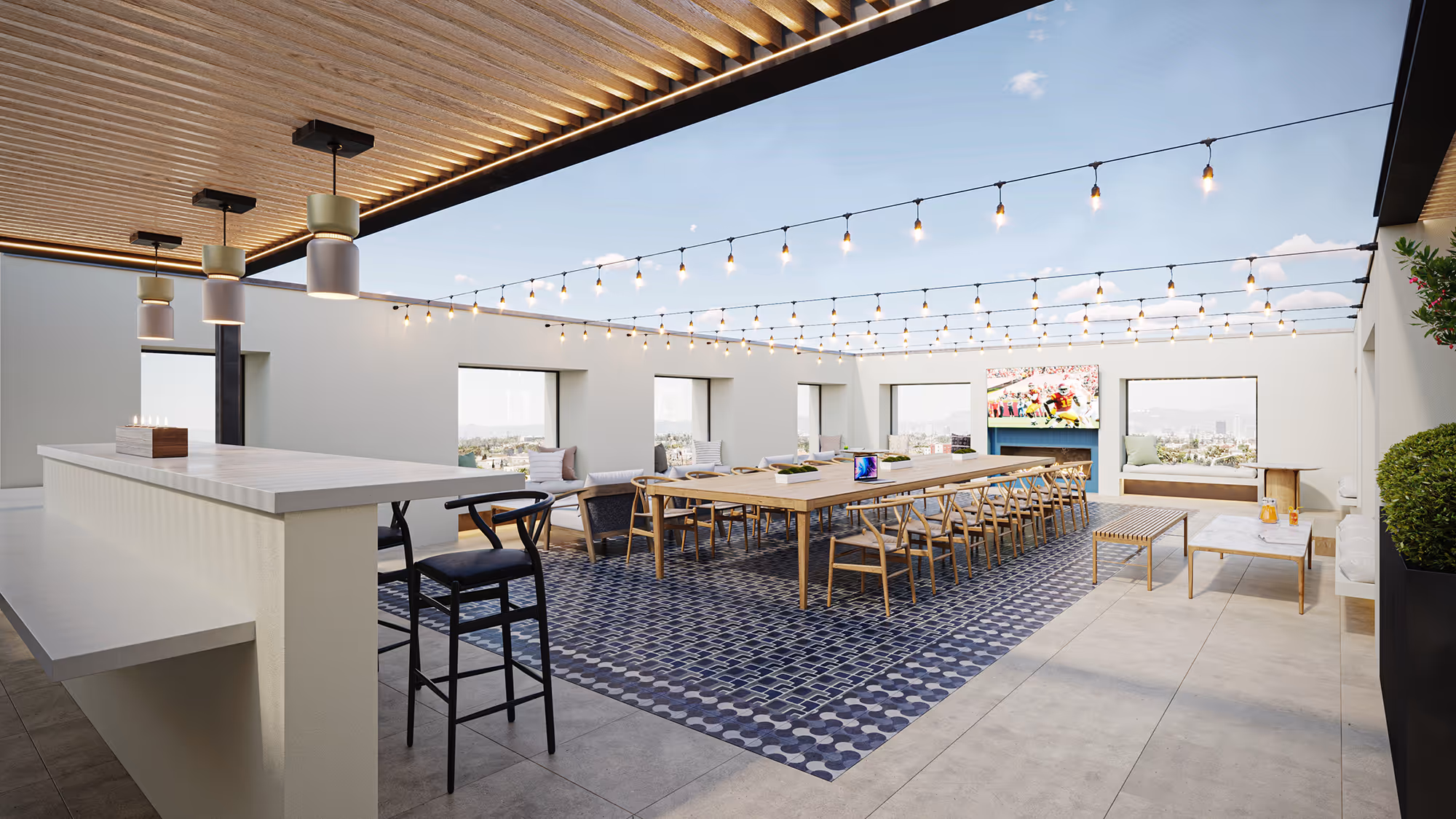 Modern co-working lounge with individual desks, communal seating, and computers, providing a productive environment for residents at Tessera in Los Angeles, CA.