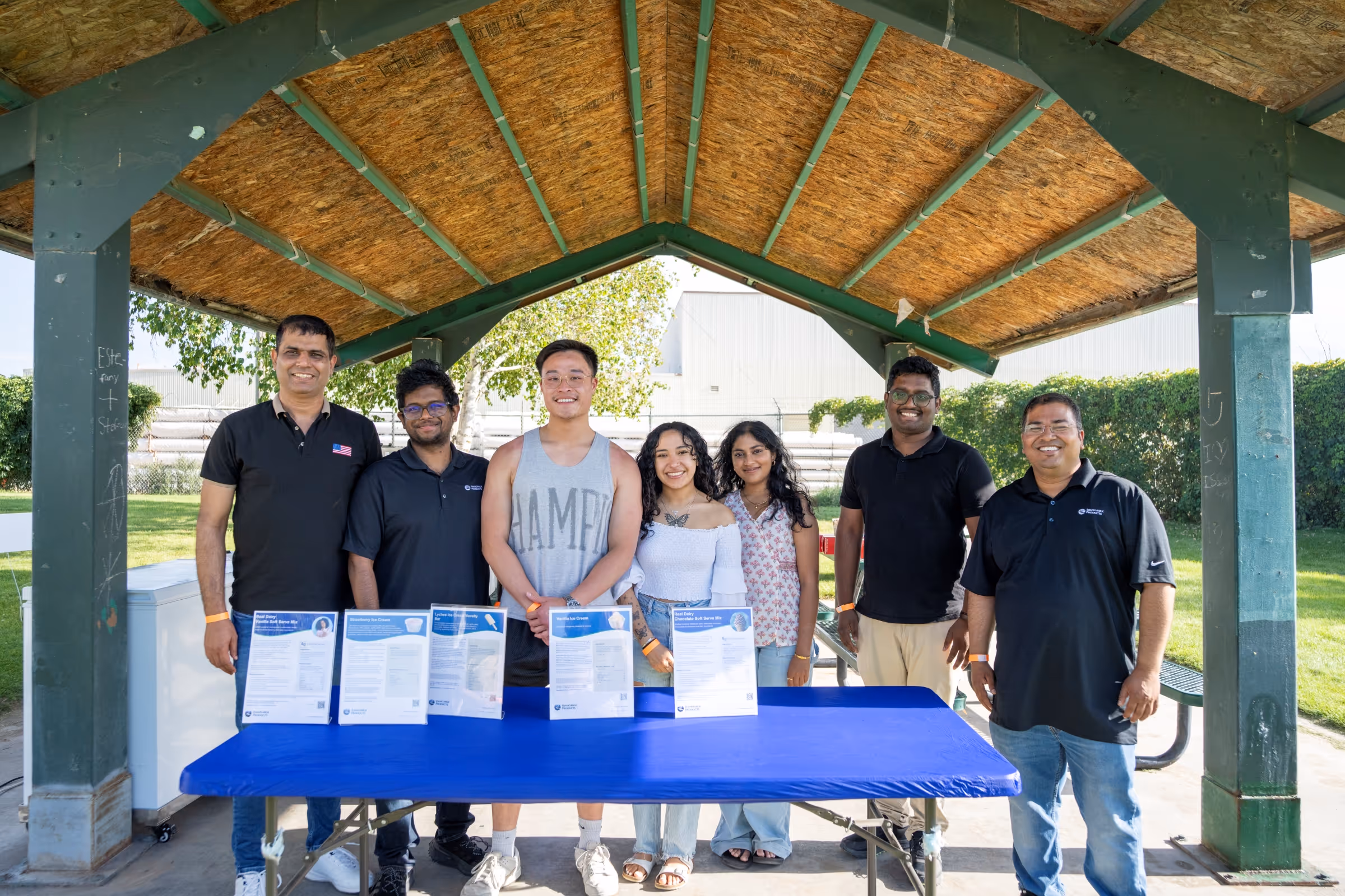 A group of employees smiling