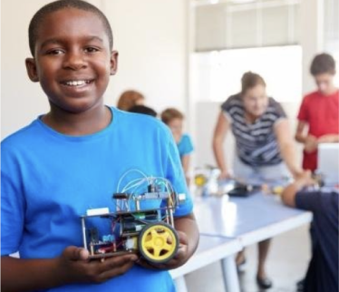 Boy showing motor project