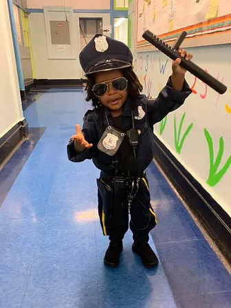 Kid wearing Police dress at Fancy Dress Day