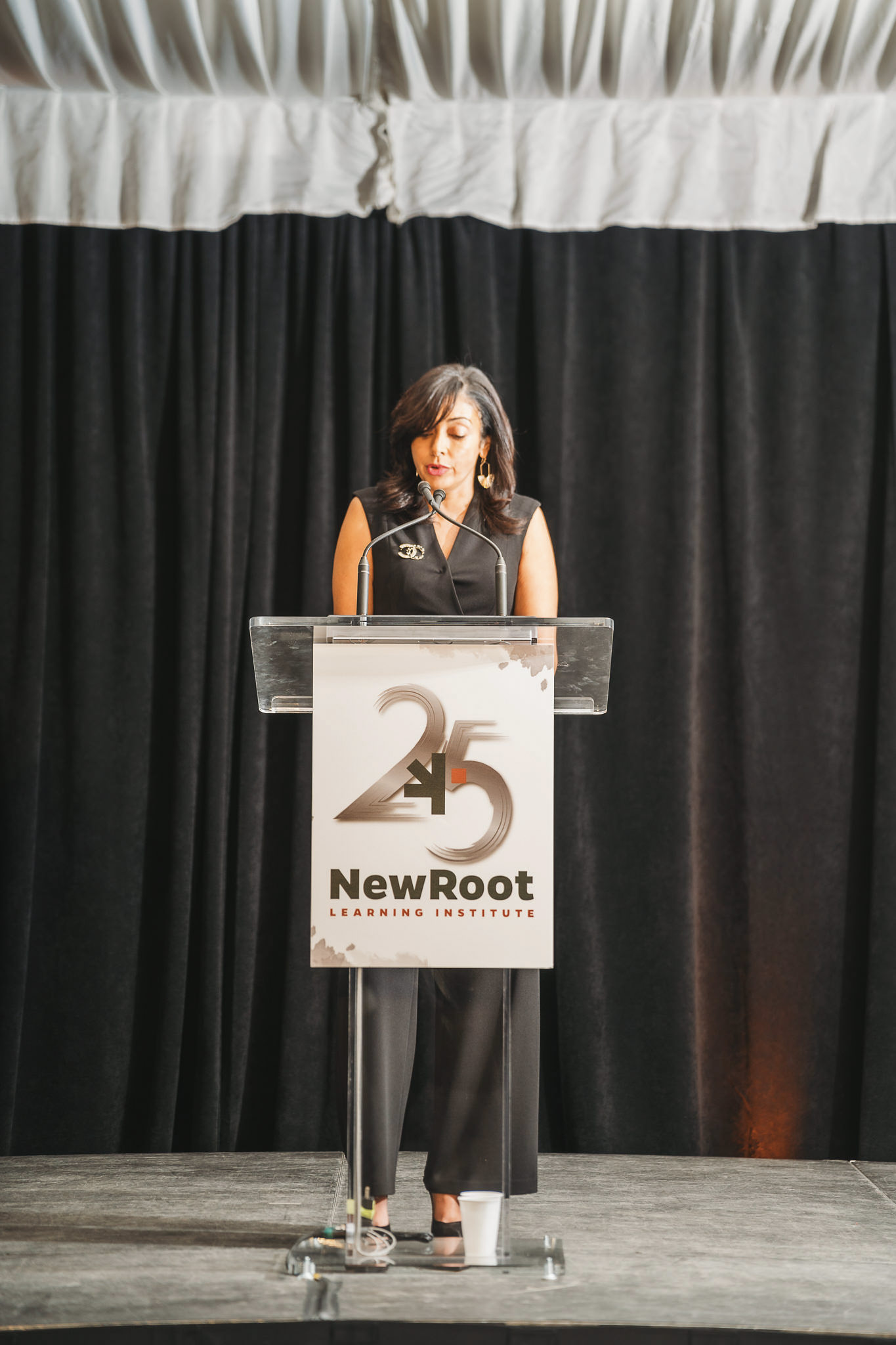 A woman standing at a podium