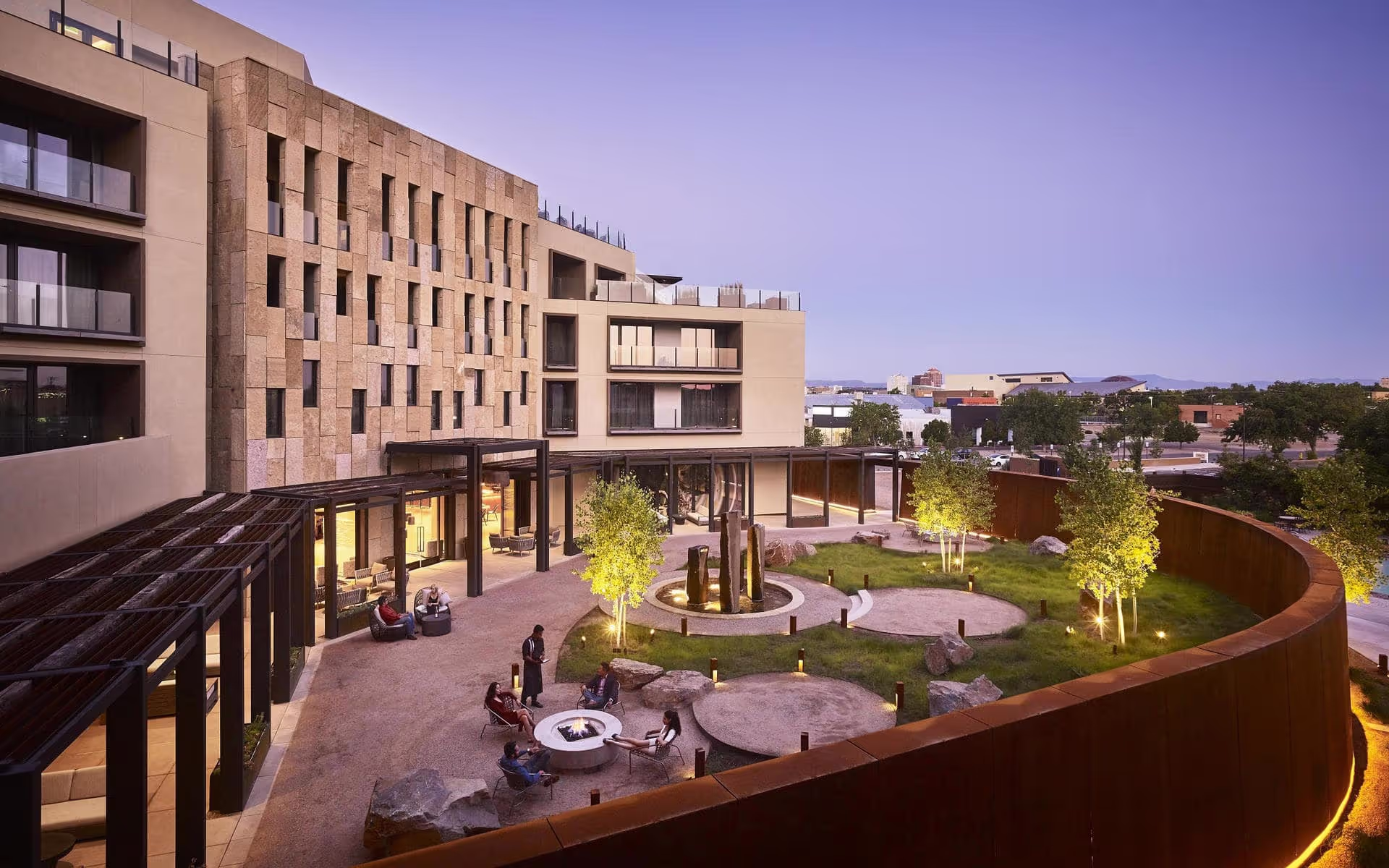 Exterior of Hotel Chaco's courtyard with fountain and trees 