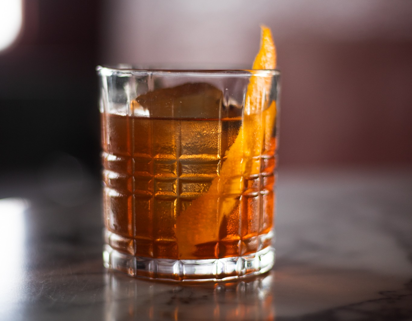 old fashioned cocktail with orange twist