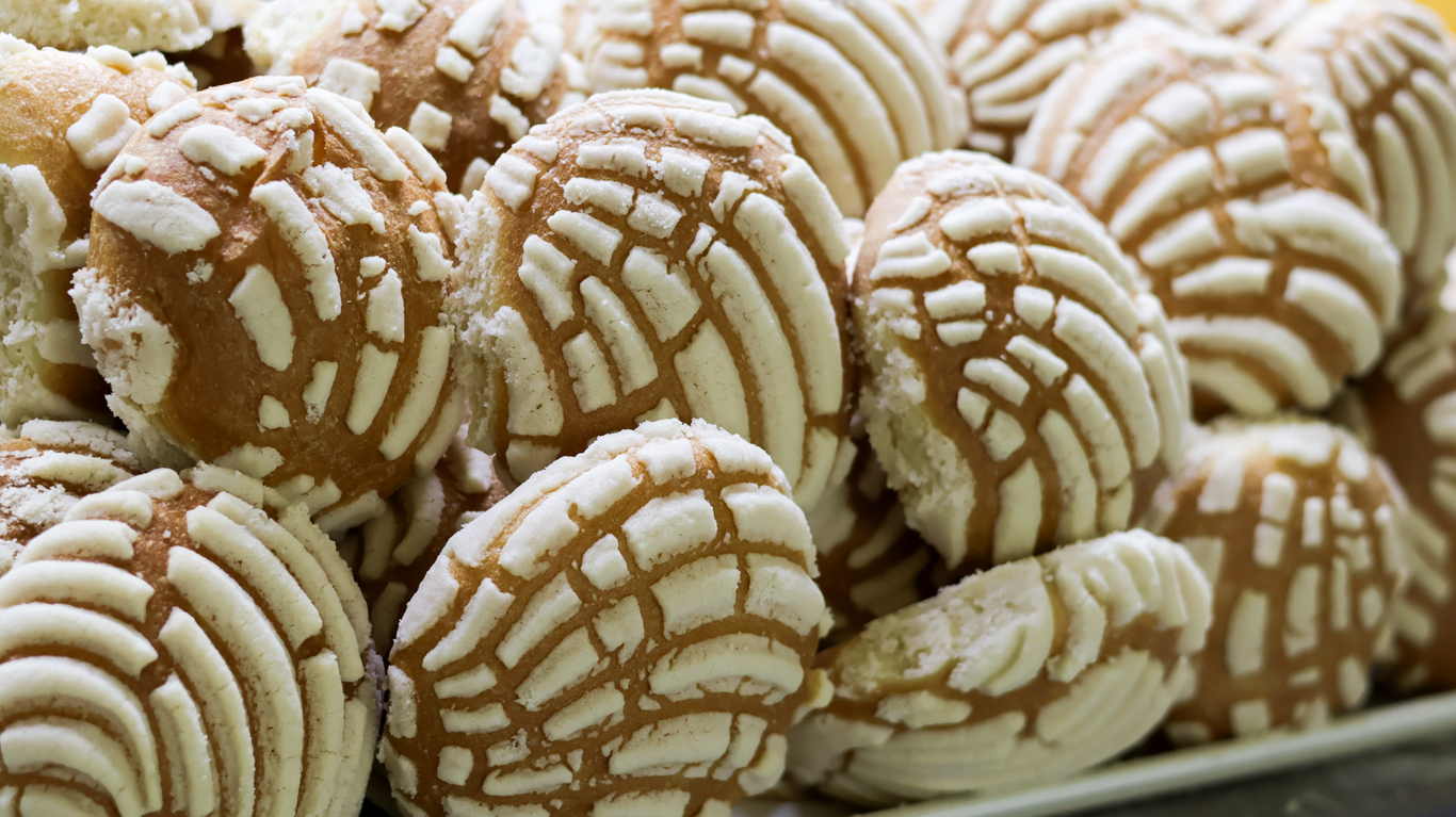 Dozen Conchas with white icing