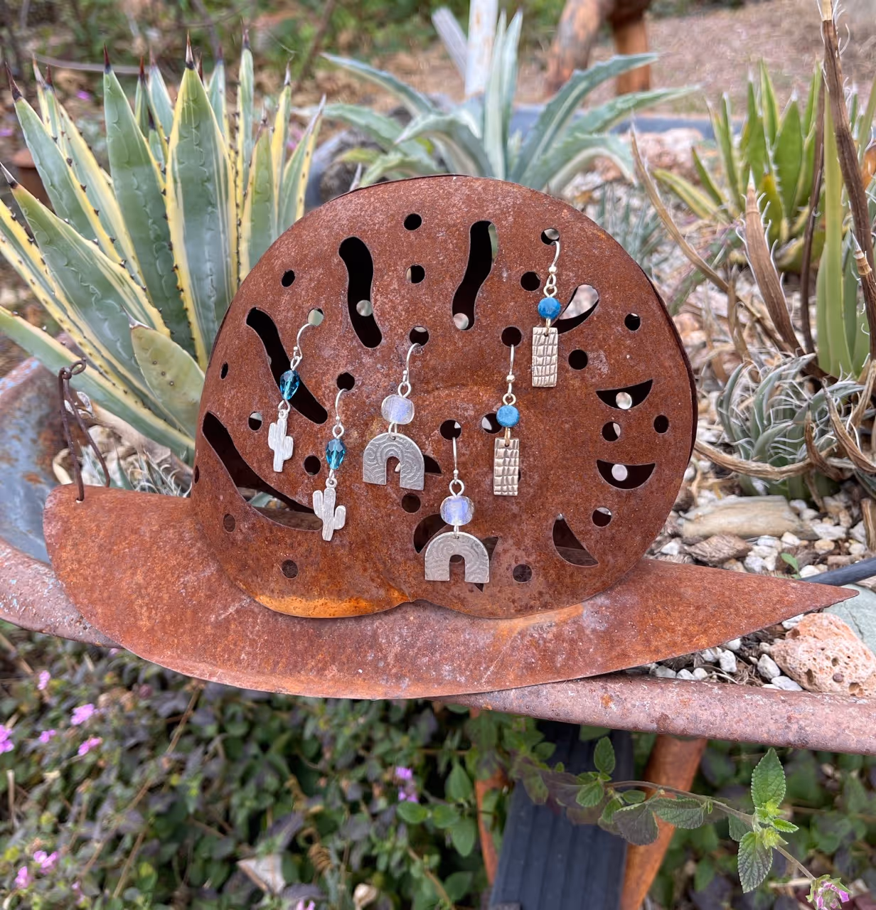 Trio of Earrings on Snail by Lyle Rayfield