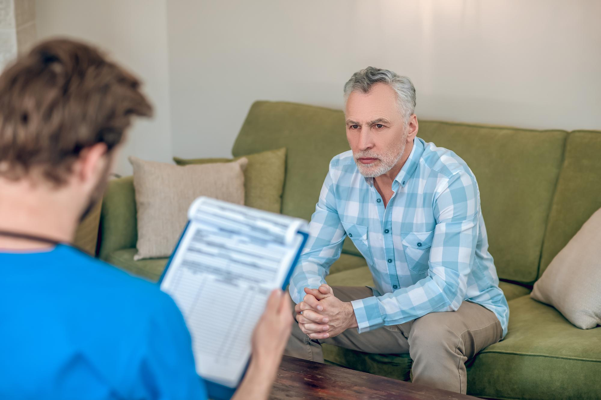 Case manager discussing recovery plan with patient