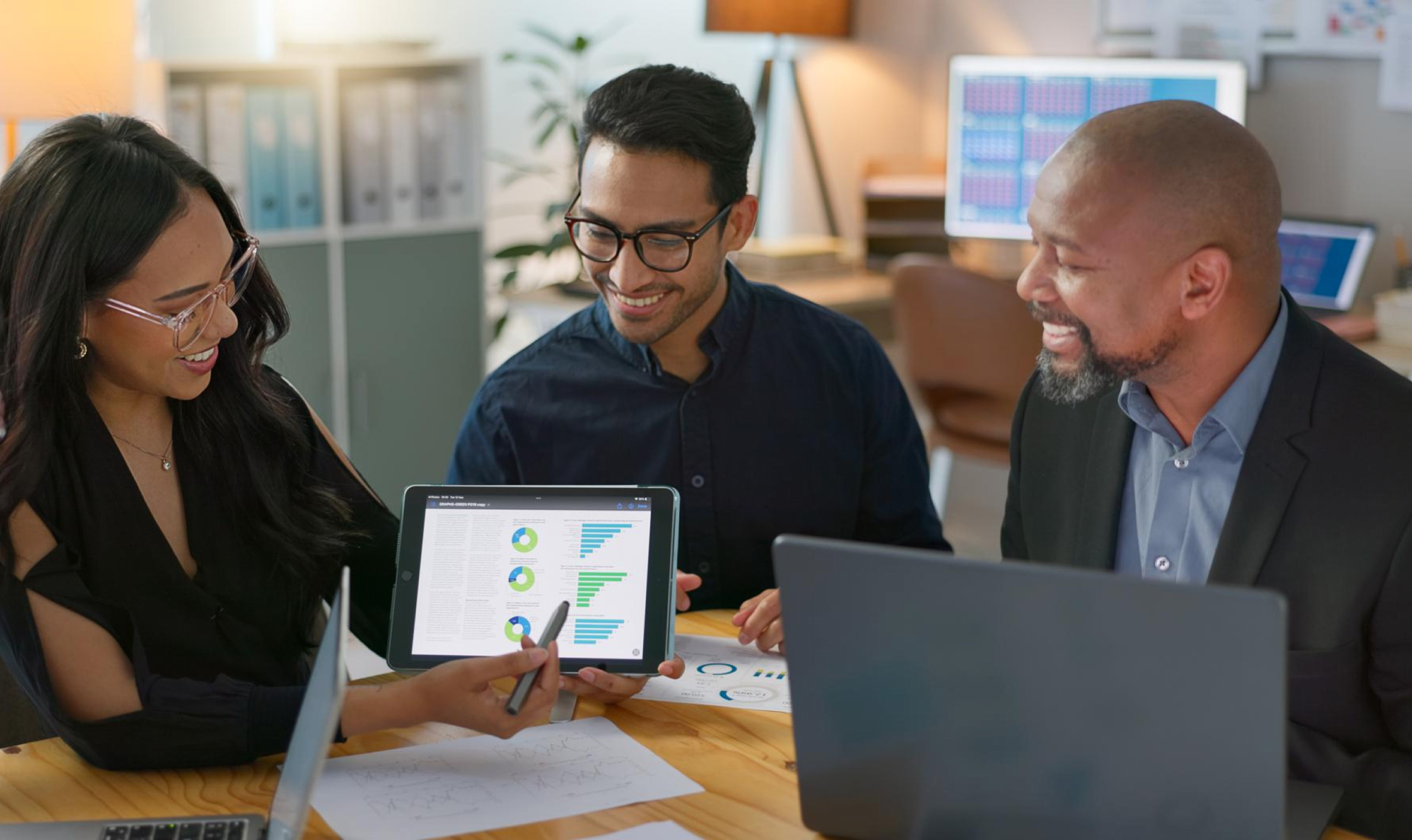 Staff supporting outcome-based funding strategies with digital tools