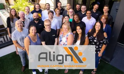 Group of diverse professionals standing outdoors smiling behind a transparent overlay with the Align Human Capital Management logo.