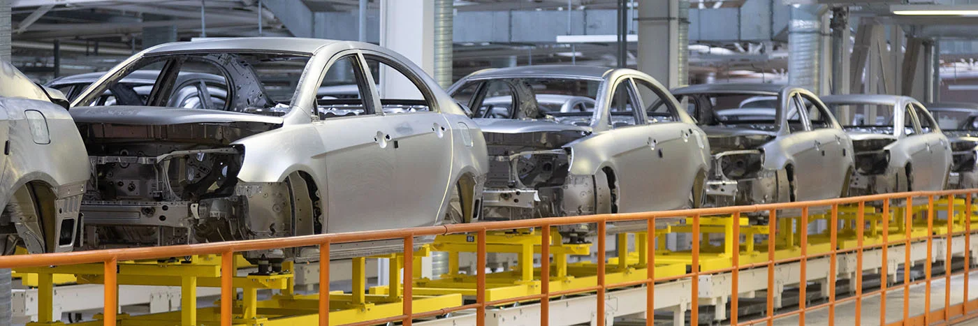 A vehicle assembly line in an automobile manufacturing facility