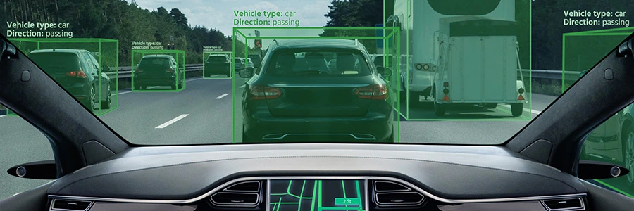 A visualization of an autonomous vehicle's computer detecting other vehicles on a highway