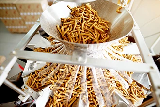 A food processing facility machine, representing VarTech's Systems computers and monitors for the food processing industry