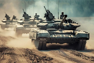 Tanks with soldiers driving on a dirt path, representing VarTech Systems' rugged MIL-STD compliant computers and monitors