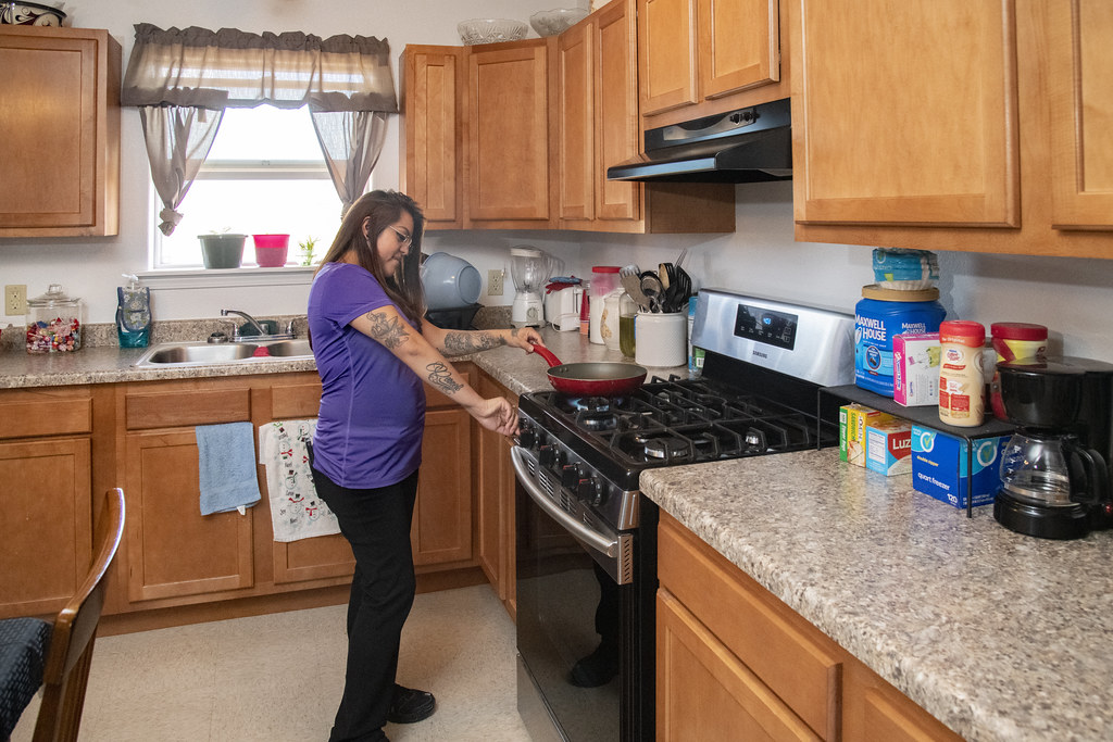 Home helper preparing a meal in a kitchen