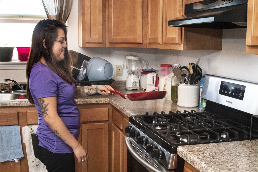 Domestic worker cooking in a private home