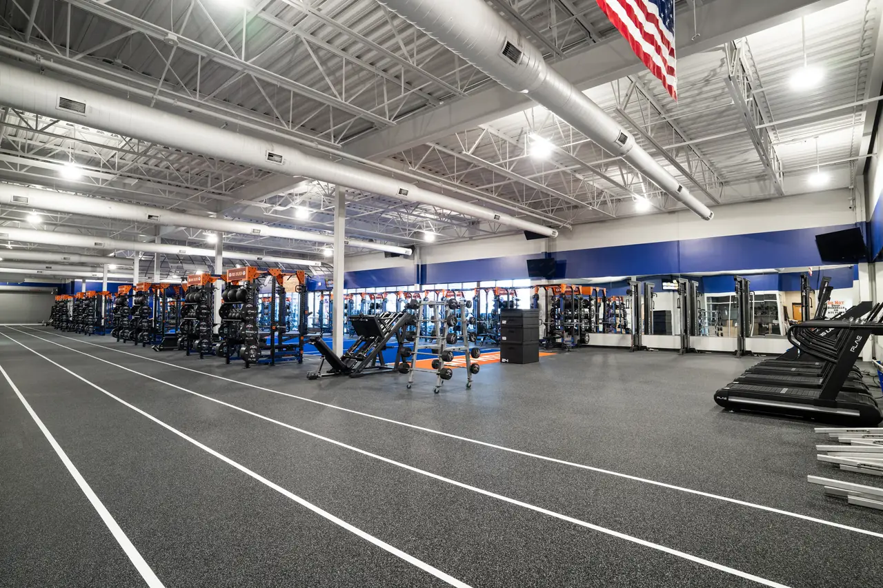 Open performance training space combining ATTACK Performance Turf, ACHIEVE Rubber Flooring and custom PLAE strength equipment.