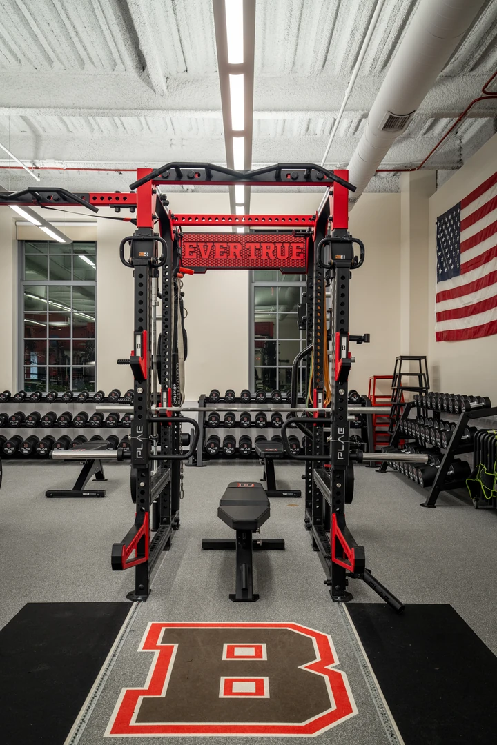 Front view of a custom PLAE ICONx rack with custom "Ever True" branding, integrated storage and PLAE bench at Brown University.