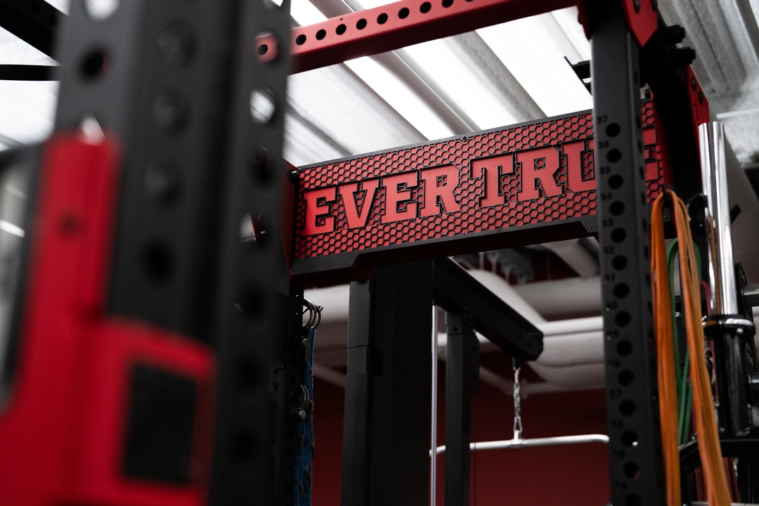 Close-up of a custom PLAE ICONx rack featuring bespoke "Ever True" branding above the lifting station.