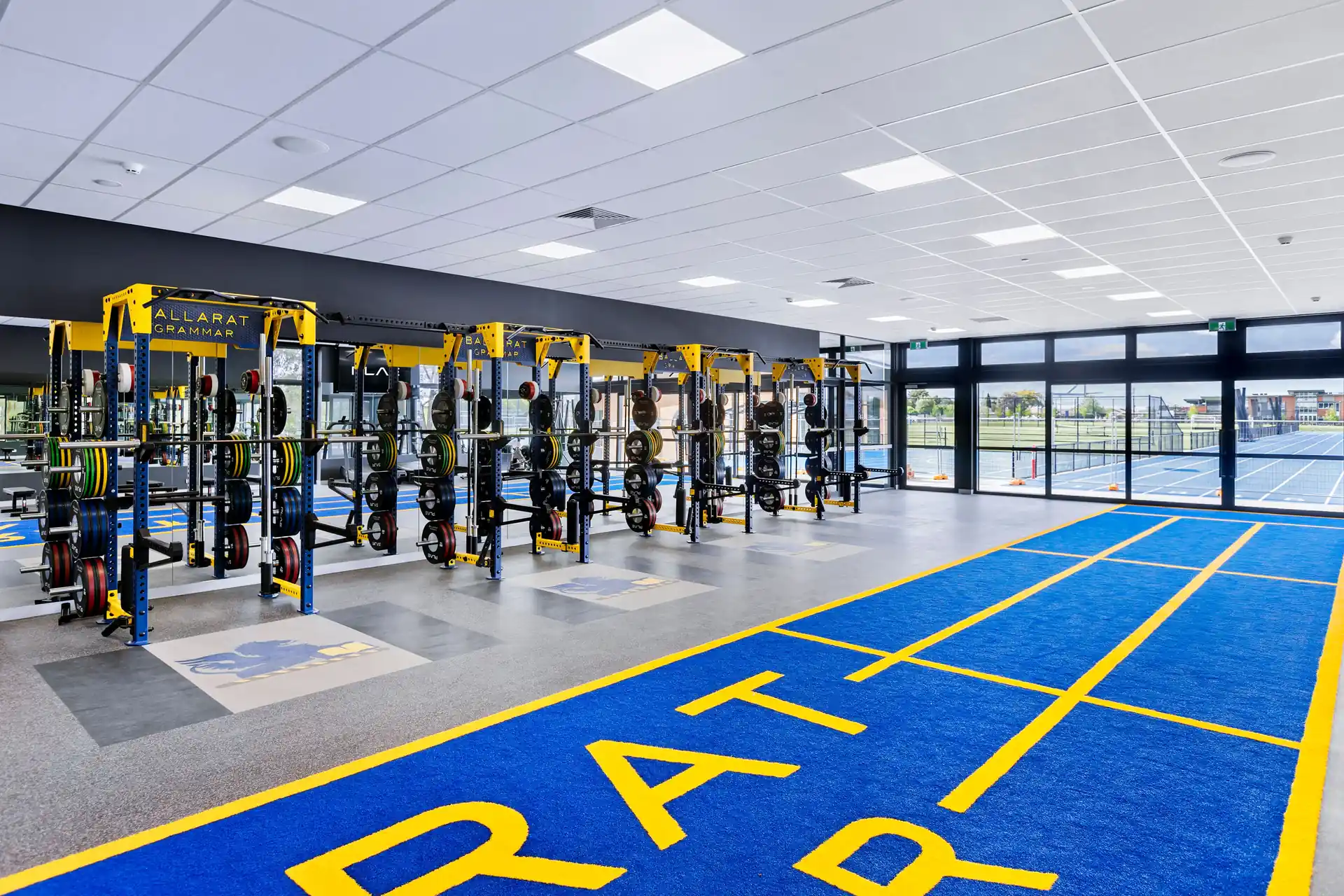 PLAE ICON X racks and Ballarat Grammar ATTACK turf lanes with views out to the school's outdoor athletics track
