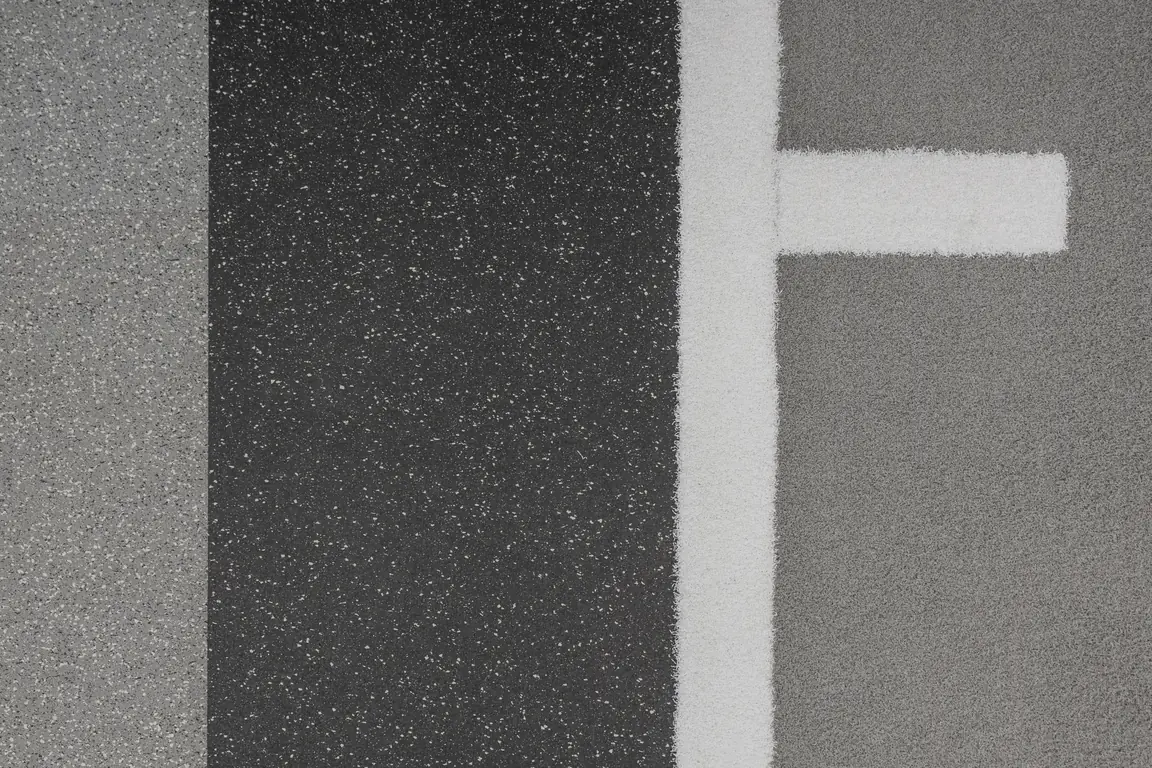 Close-up of PLAE Achieve rubber flooring with inlaid white sprint-track lane markings at The Mill performance centre in Queenstown, New Zealand.