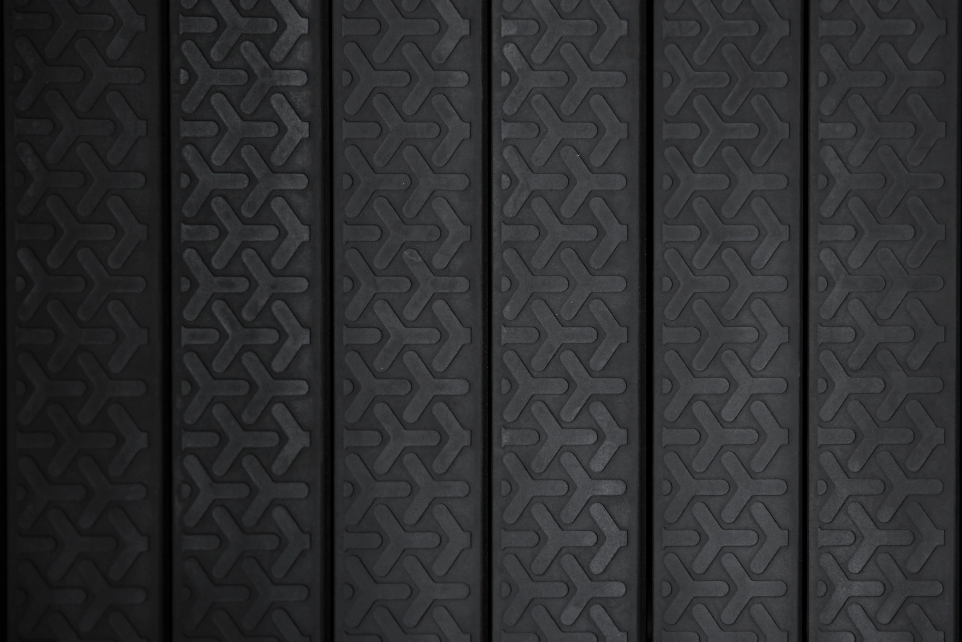 Close-up texture of black ACHIEVE 18mm rubber flooring