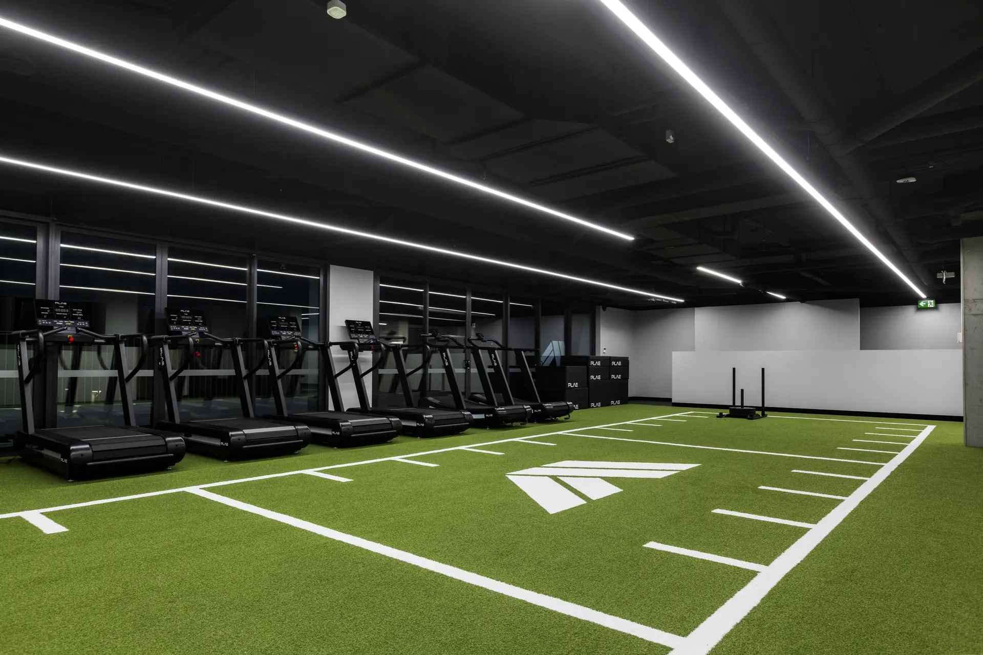 ATTACK Performance Turf lane with white markings and PLAE logo beside the rack line at Athletes Authority Sydney
