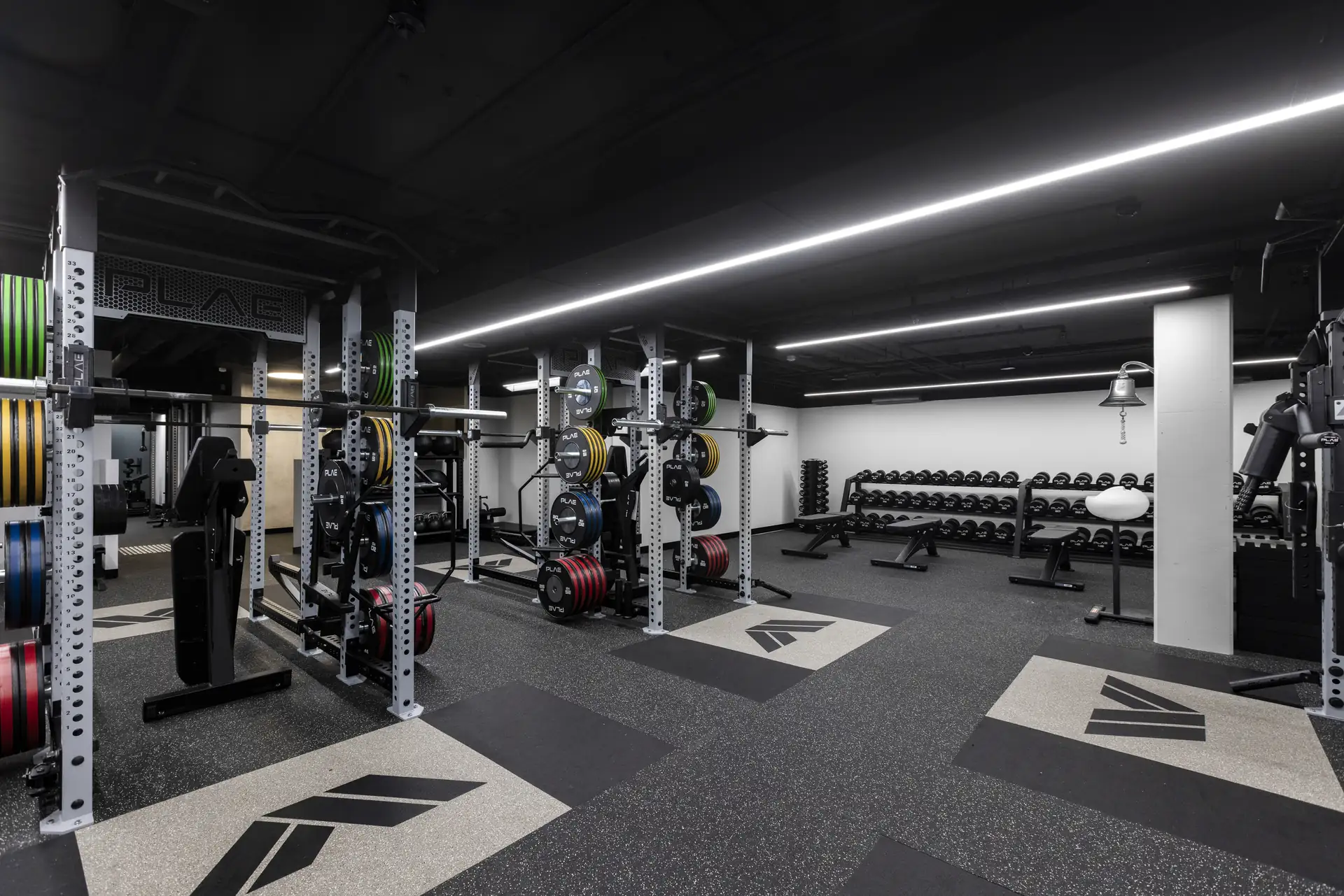 Athletes Authority Sydney training floor with ICONx rack ecosystem and PLAE-branded lifting platforms set into ACHIEVE 18mm flooring