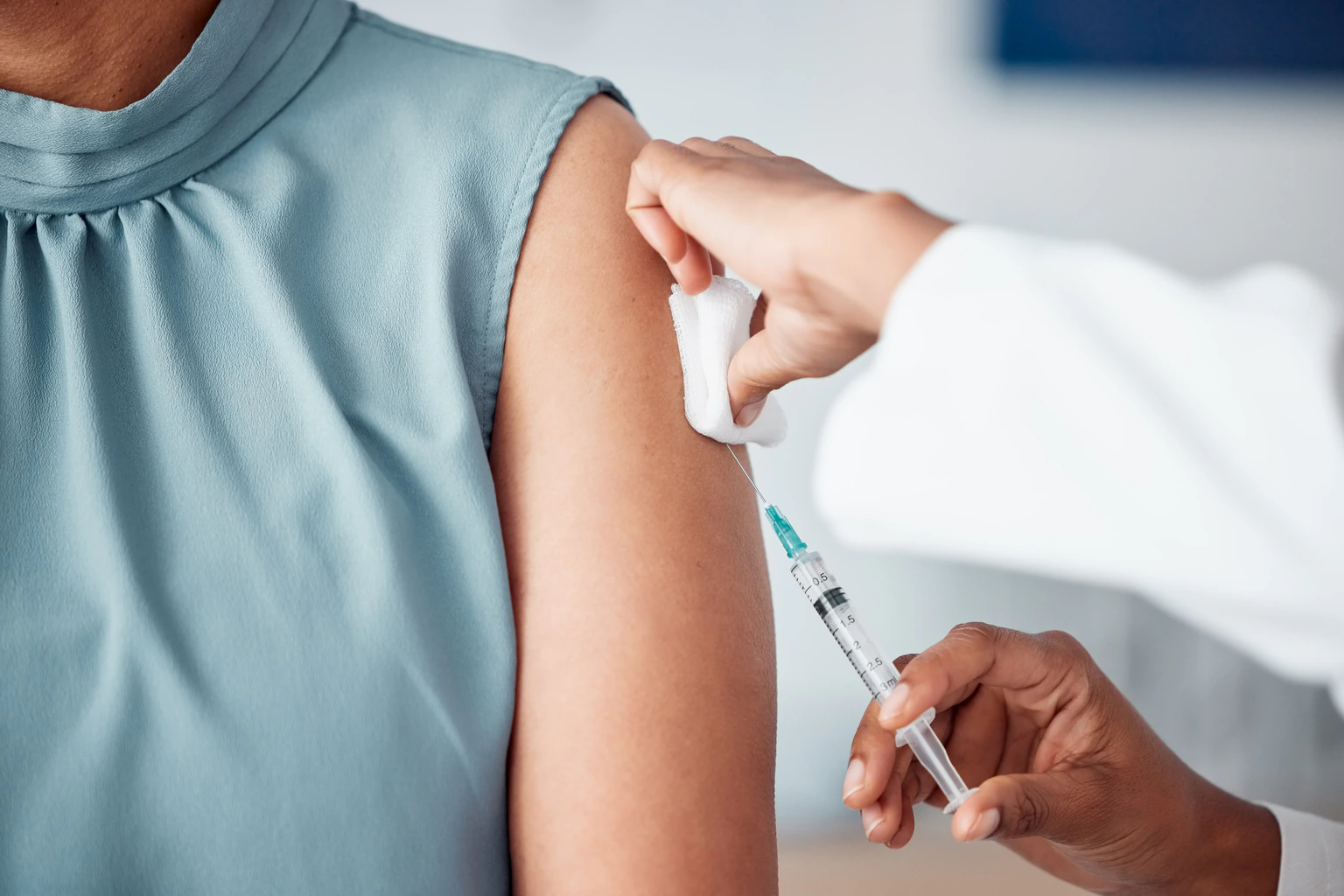 Doctor giving routine vaccination