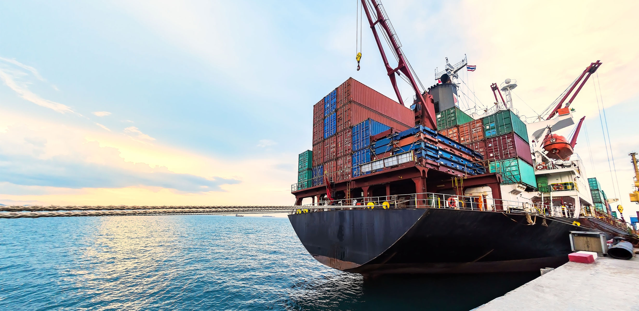 Cargo ship docked with shipping containers