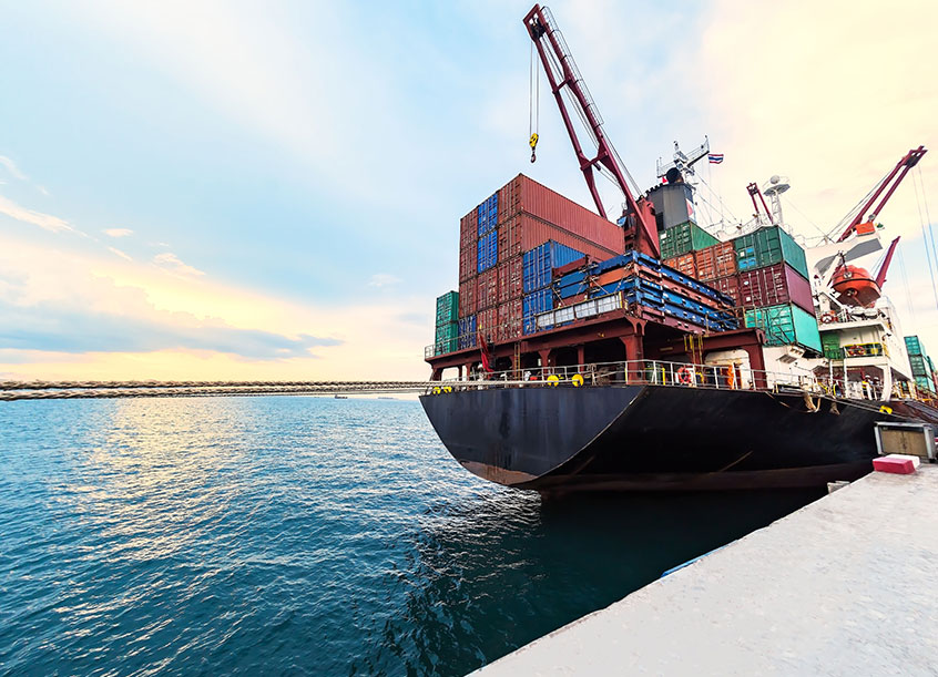 Cargo ship docked with shipping containers