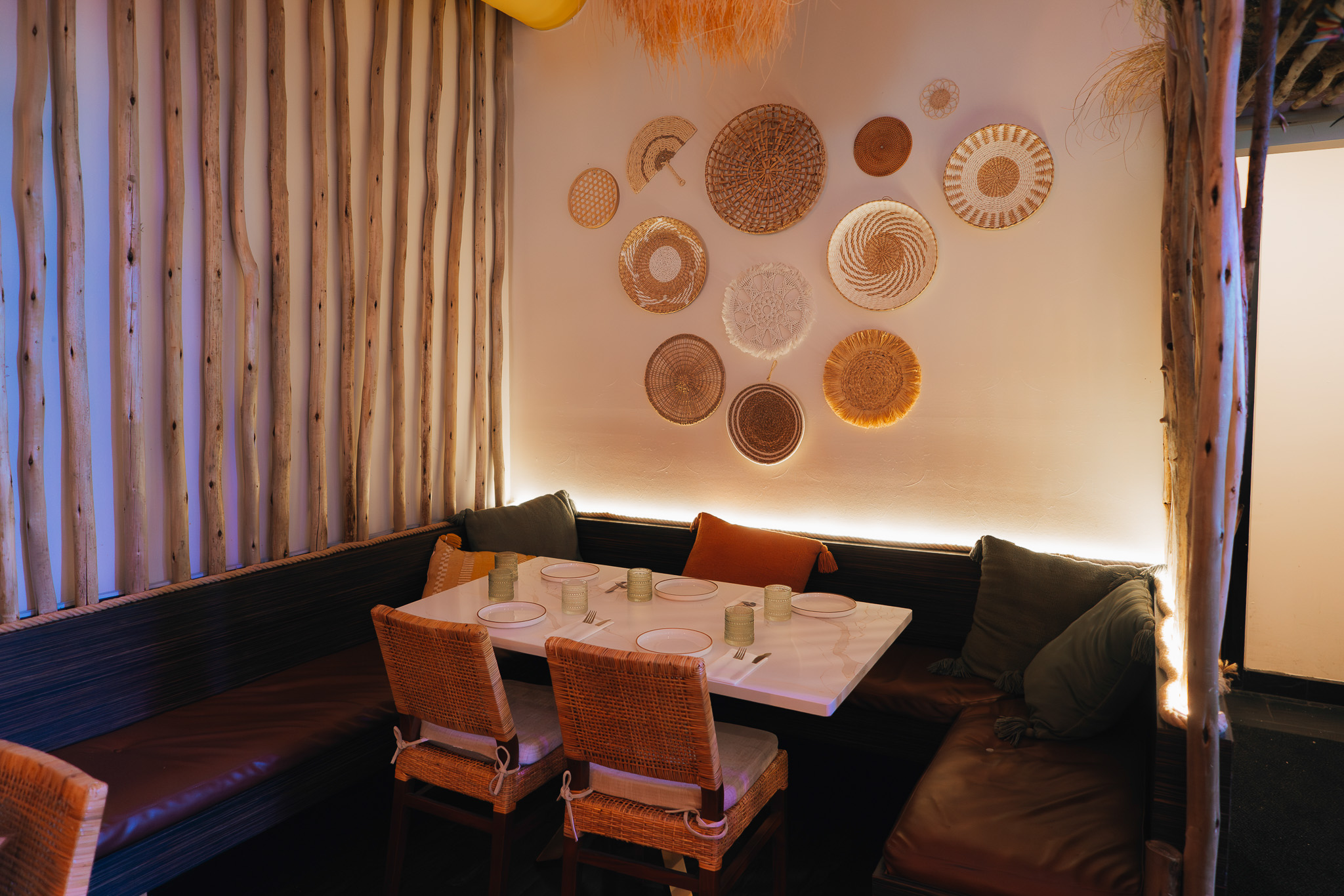 Casa Tulum banquette with woven basket wall