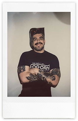 Instax of Shay Kitoff wearing a Foghorn Baths t-shirt