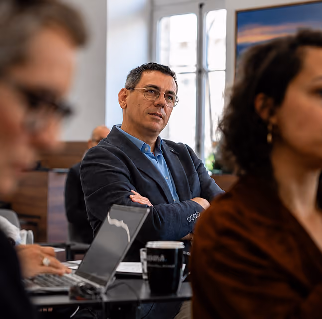 Hiring team discussing candidates in a meeting