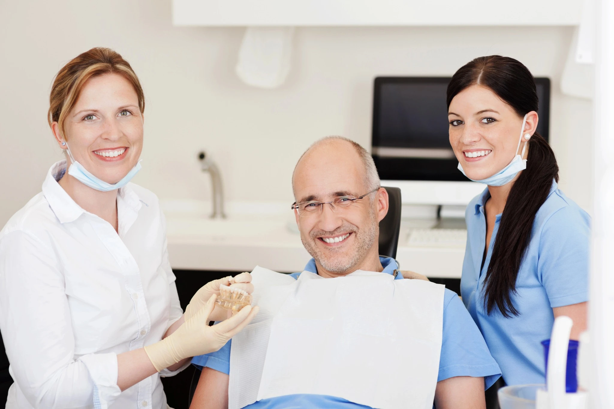 teeth-in-a-day-dental-implants-happy-patient-with-dentist