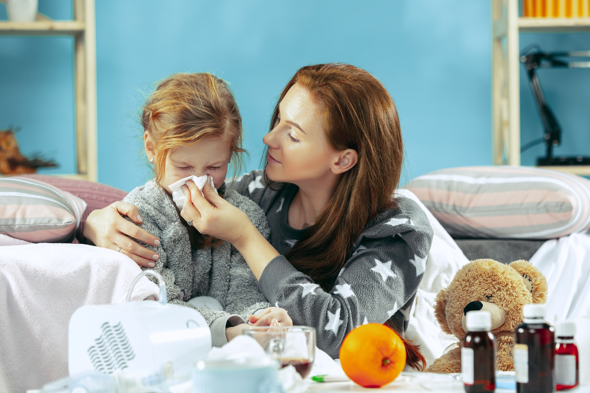 Sick woman with daughter at home