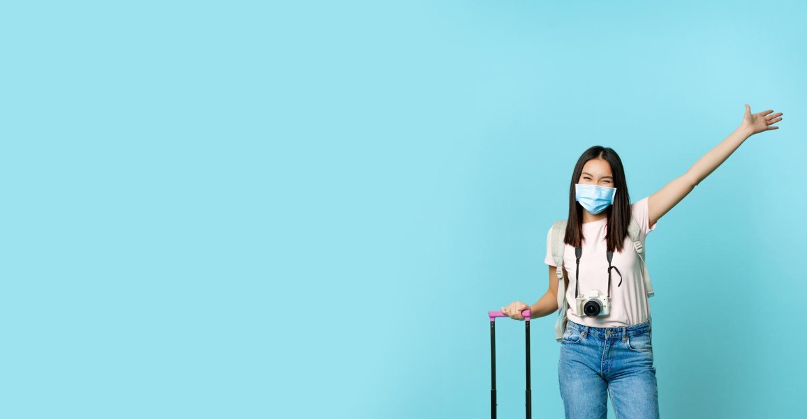 happy girl tourist wearing face medical mask