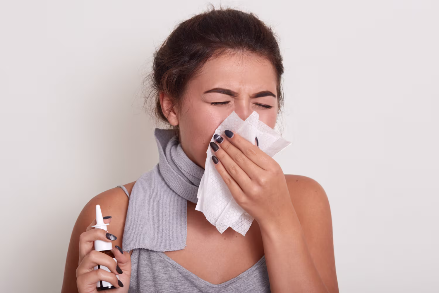 Non-allergic rhinitis woman blowing running nose