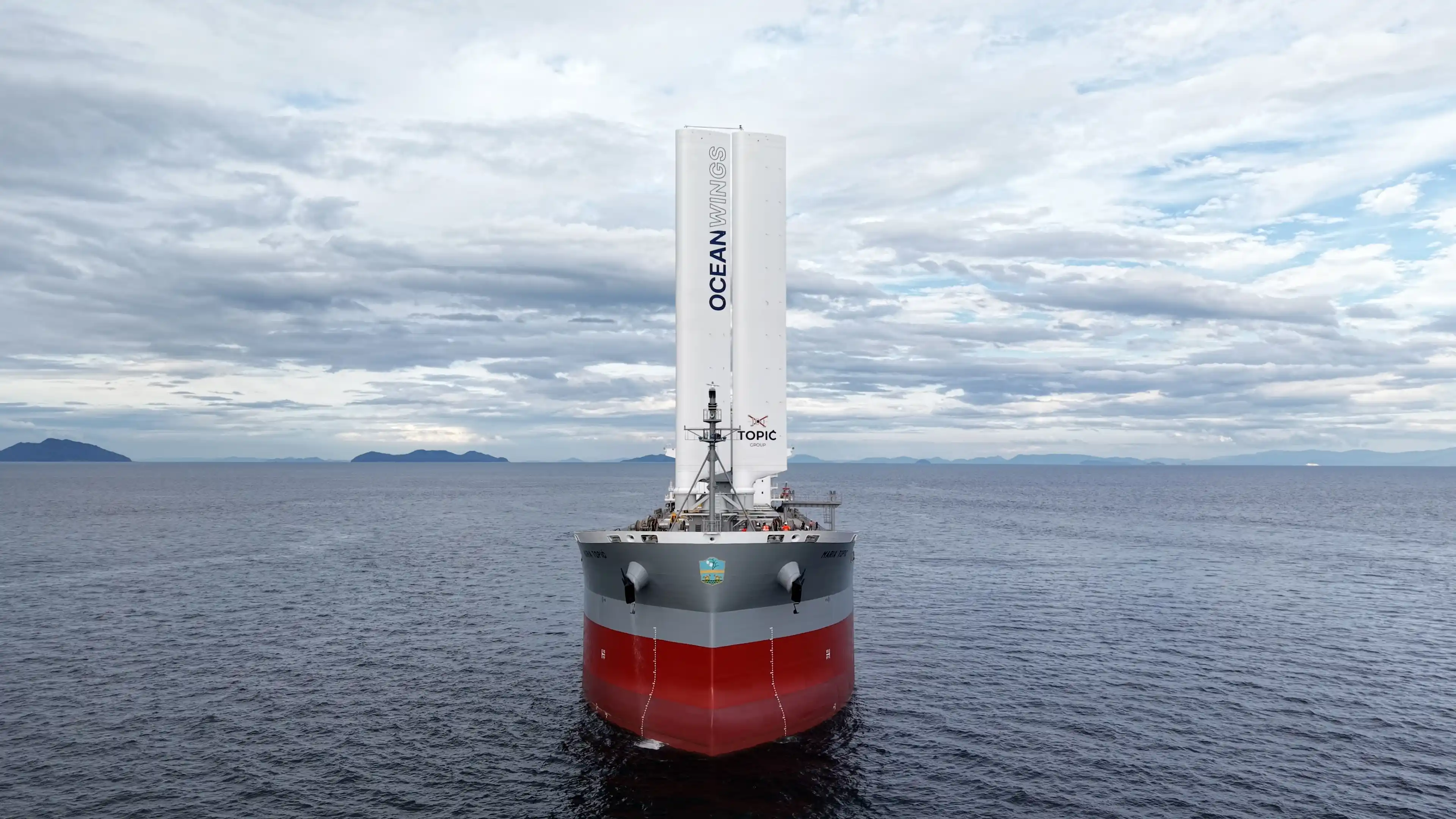 Front view of a Ultramax bulk carrier equipped with an OceanWings rigid wingsail retrofit.