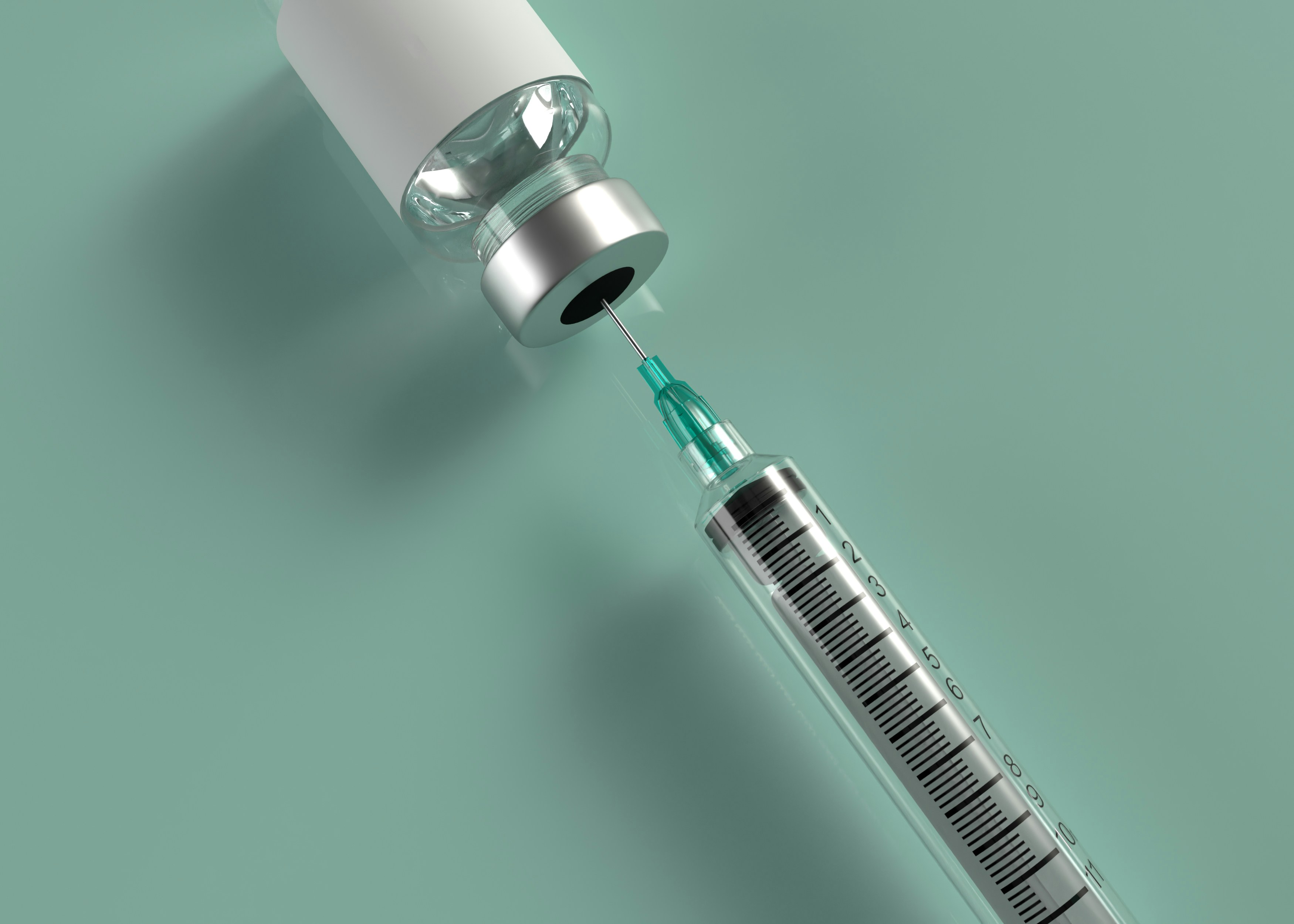 Syringe drawing a liquid sample from a medical vial