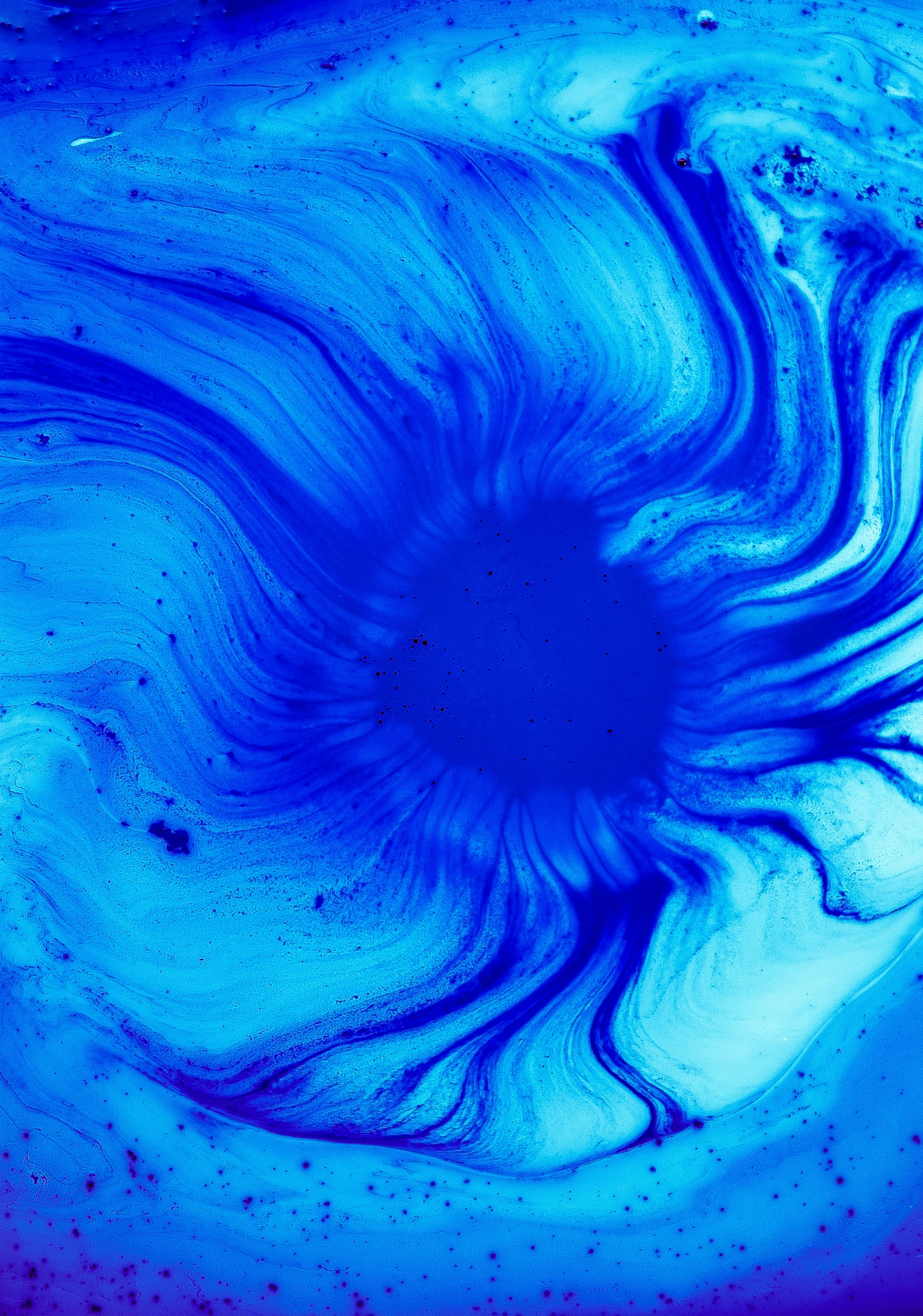 Abstract blue swirl pattern evoking a tissue stain