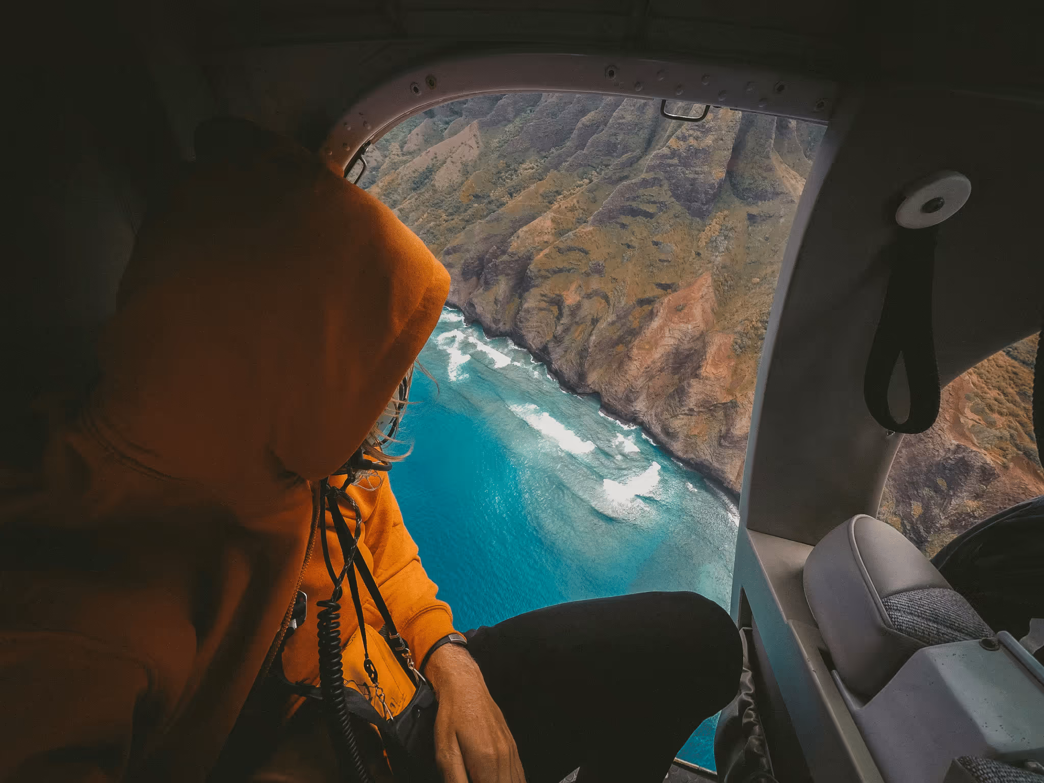 OATS Outdoor and Travel Specialist Marketing - A man looking out of a helicopter window
