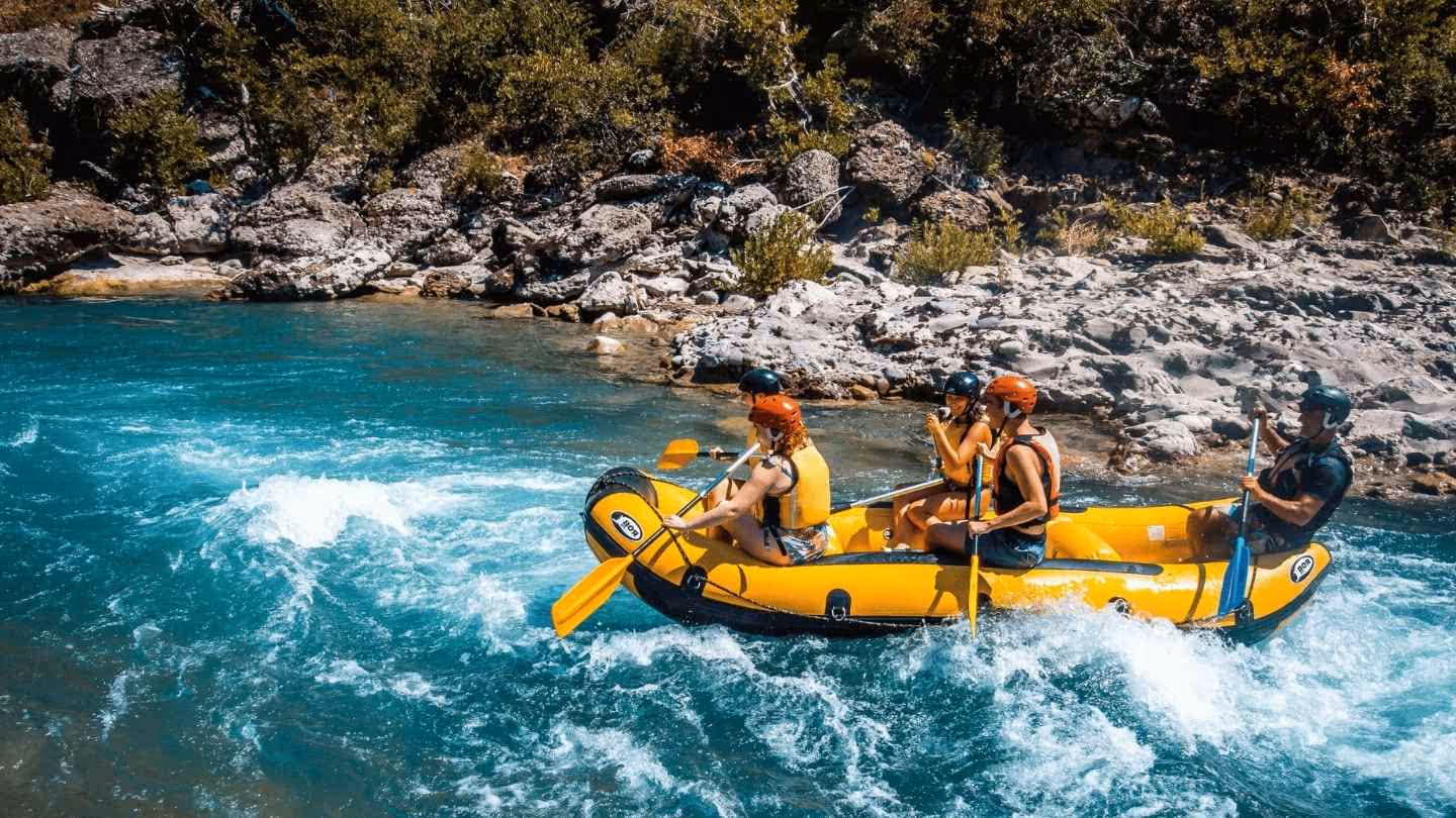 A group on an Oats Marketing rafting tour in Oregon laughing and enjoying the rapids