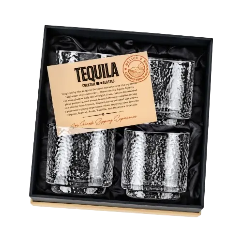 Four glasses in a box with an informational card featuring a custom logo