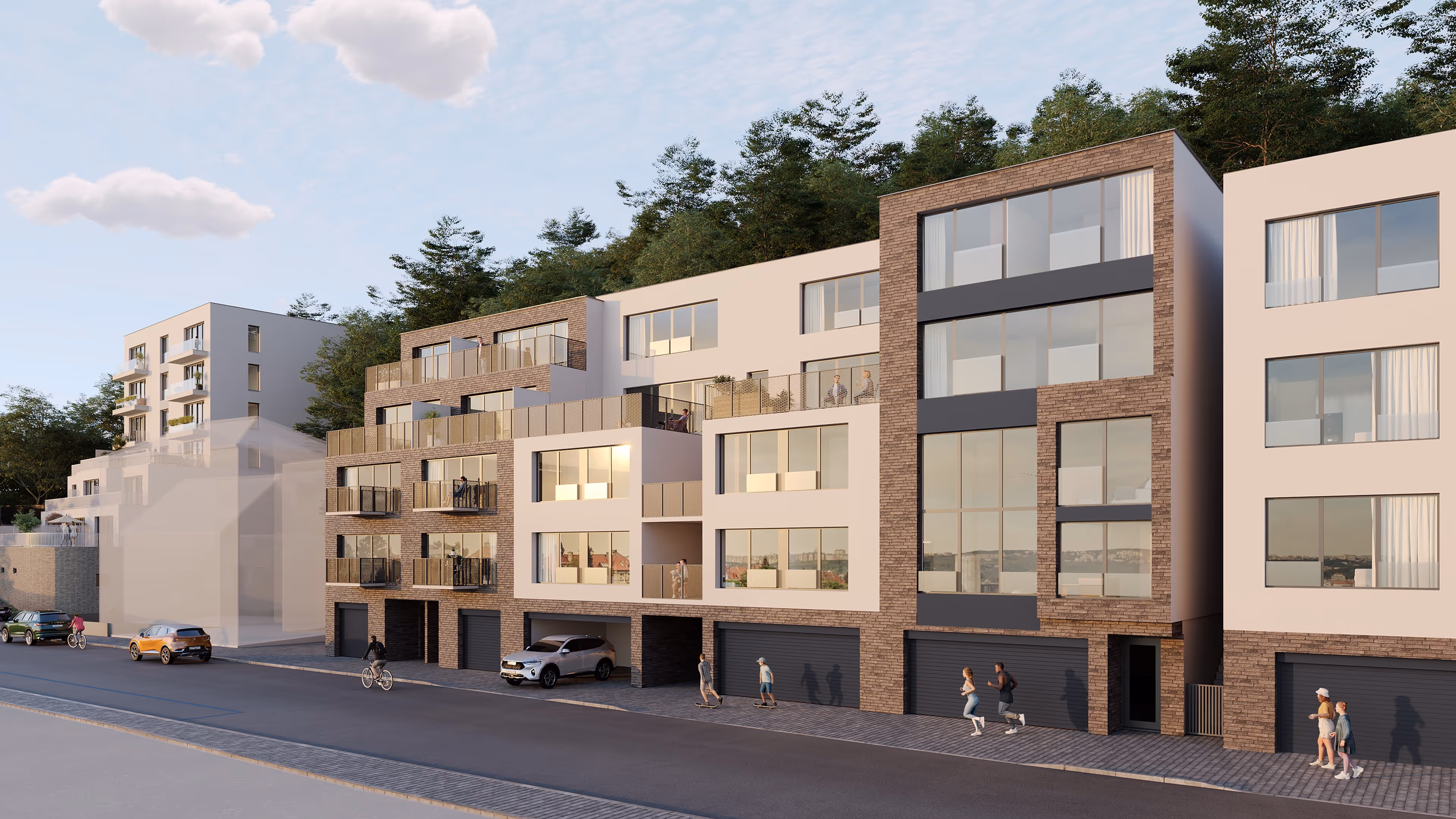 Moderní obytný komplex s vícepatrovými budovami, balkony a lidmi chodícími, běžícími a jezdícími na kole podél ulice.