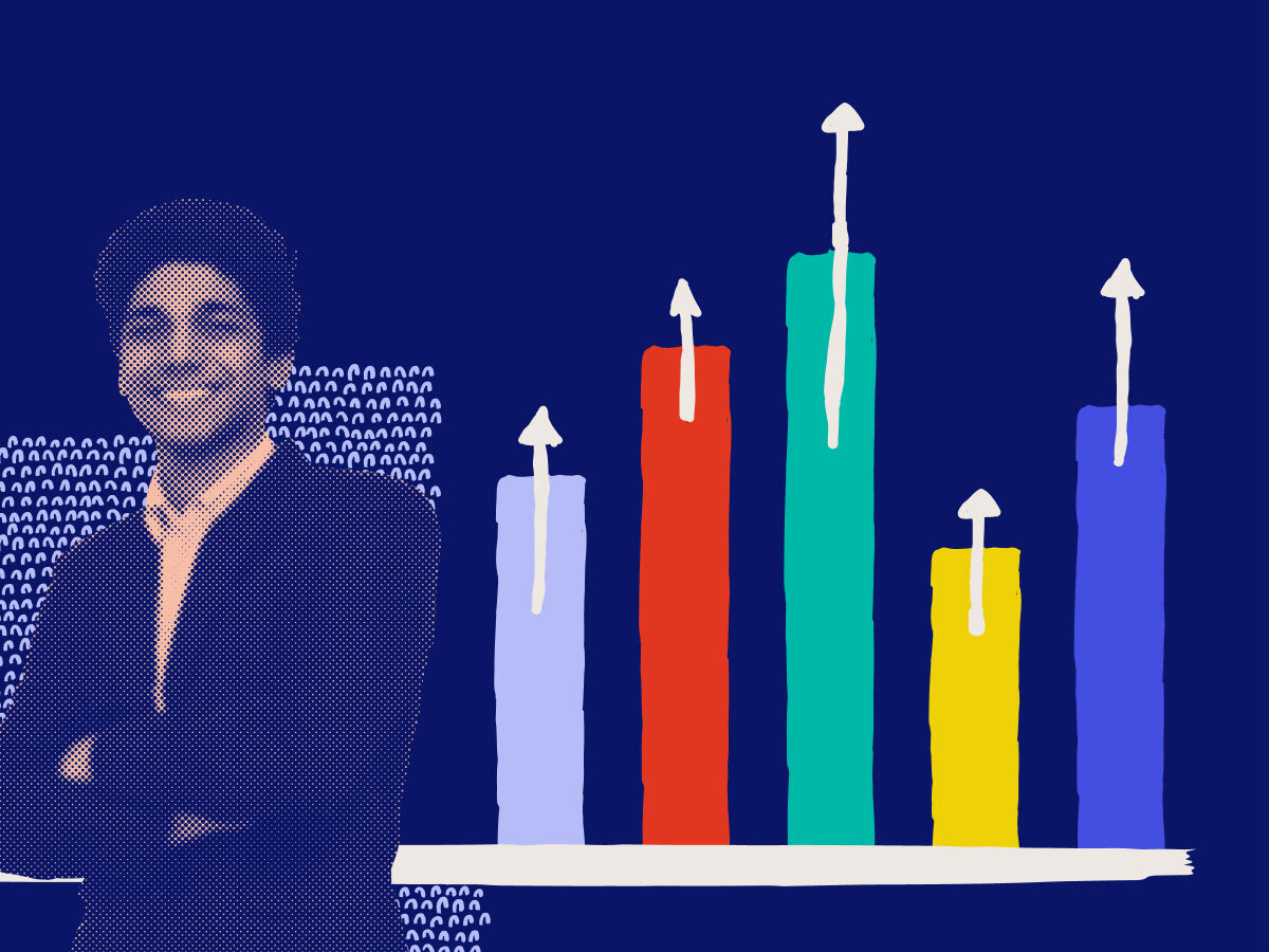 a smiling man next  to a bar chart
