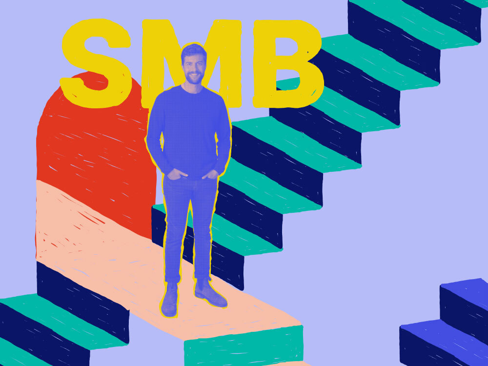 matt pogor standing in front of a graphically treated staircase with the letters SMB behind him