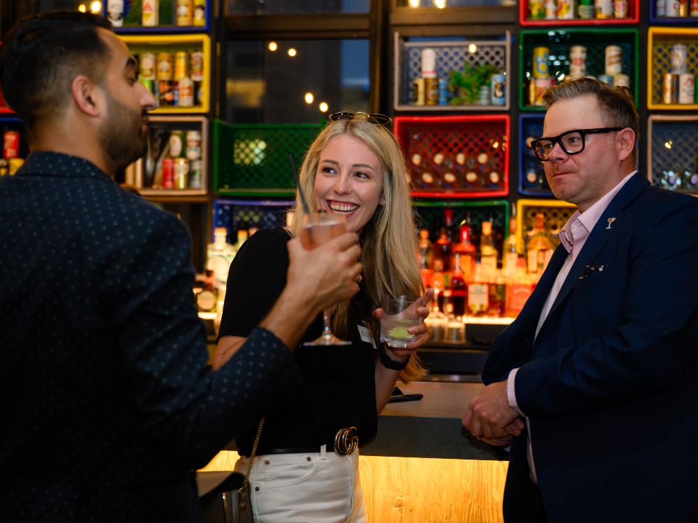 A shot of PartnerStack staff enjoying a drink at the edition of 2024 STACK'D Connect