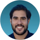 Headshot of a smiling bearded DualEntry team member in a navy polo